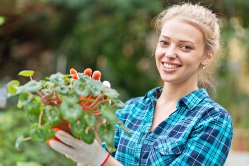 Gardener working safely with tools and protective equipment