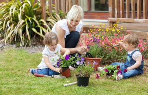 Professional gardener preparing a UK garden service agreement